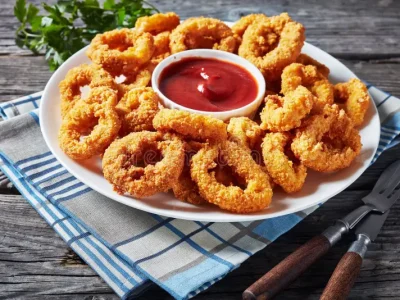 crispy-calamari-rings-white-plate-crispy-calamari-rings-deep-fried-breaded-squid-rings-served-tomato-sauce-white-157269486